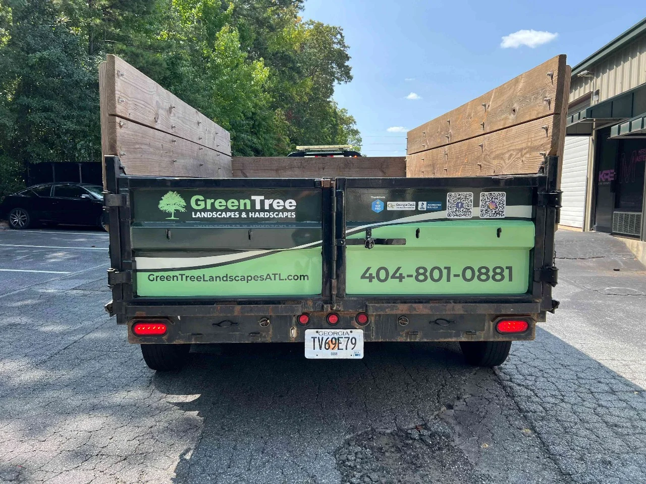Green Tree landscape truck with branded tailgate and body graphics