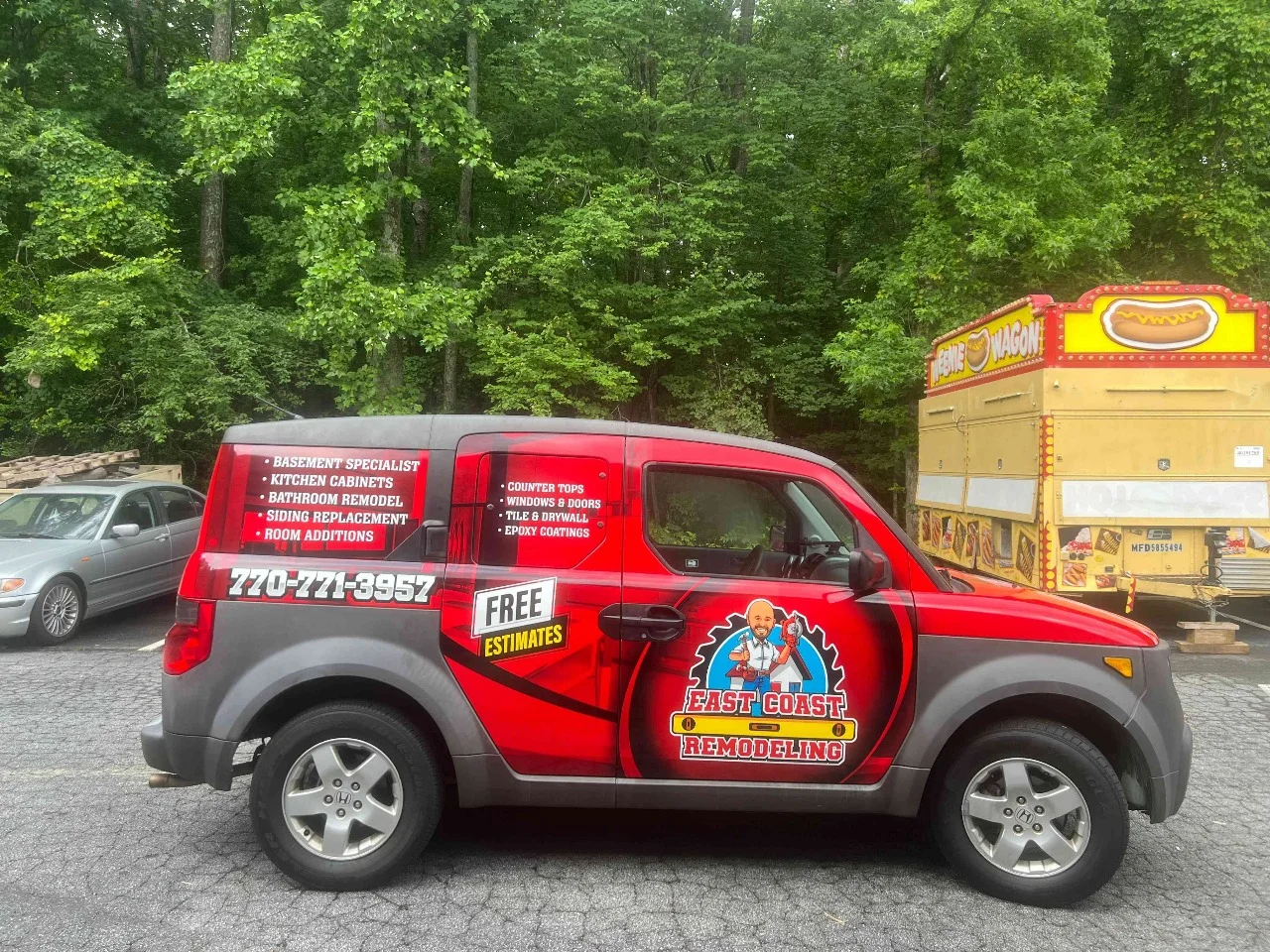 Red service SUV with full-color commercial graphics