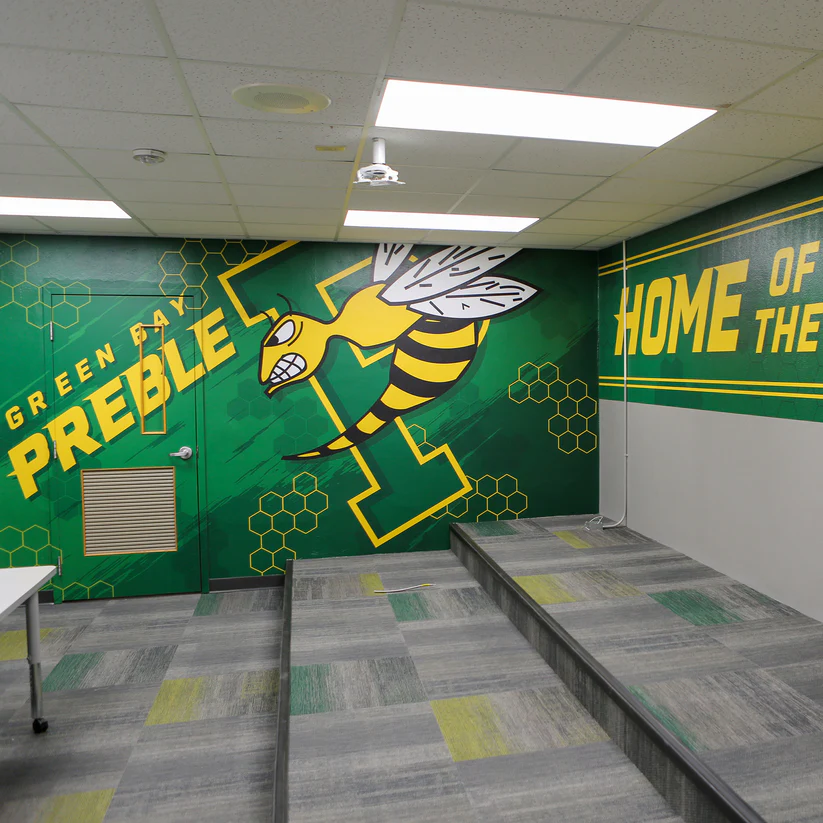 Green Bay Preble branded wall graphic with yellow hornet and school lettering