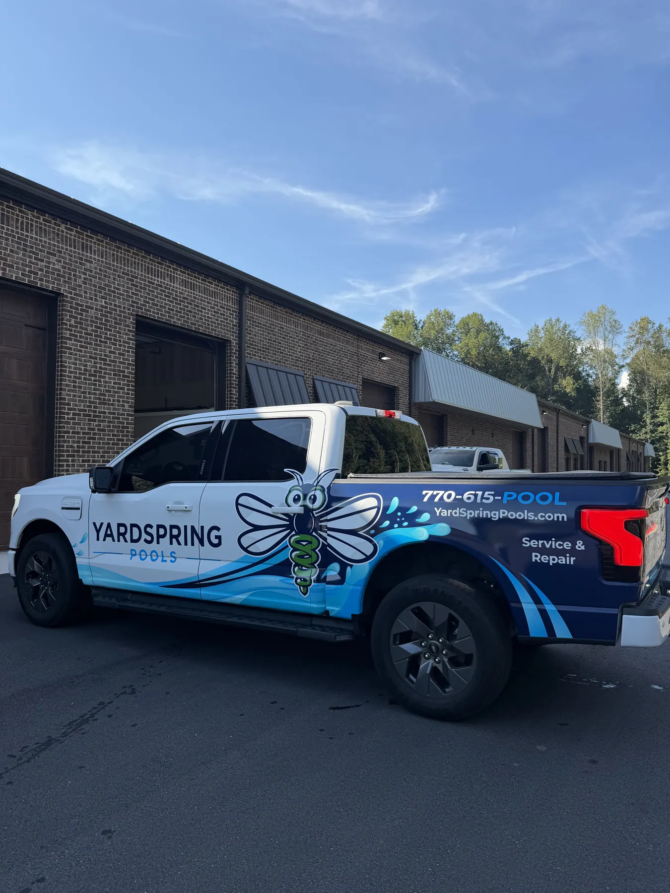 Branded Yardspring work truck parked outside